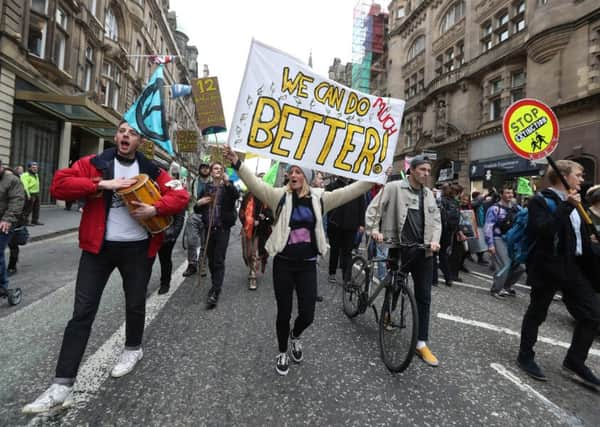 Climate protesters join Extinction Rebellion Scotland as they form a road block on the North Bridge. Picture: Andrew Milligan/PA Wire