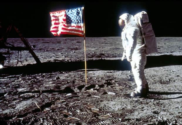 060280 01: Astronaut Edwin "Buzz" Aldrin poses next to the U.S. flag July 20, 1969 on the moon during the Apollo 11 mission. (Photo by NASA/Liaison)