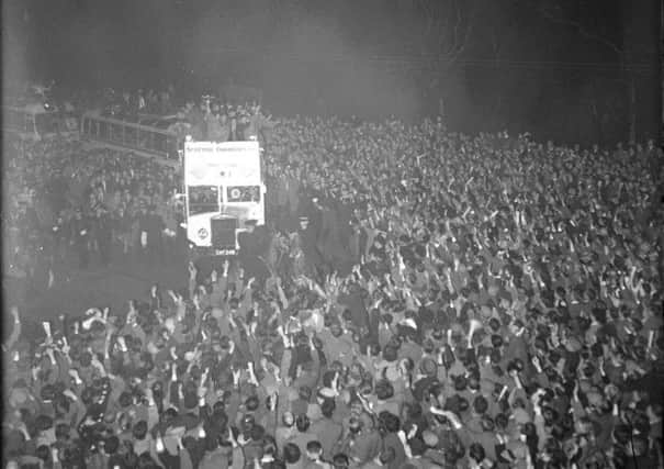 Hearts parade the 1956 Scottish Cup on an open-top bus in Edinburgh. Picture: TSPL