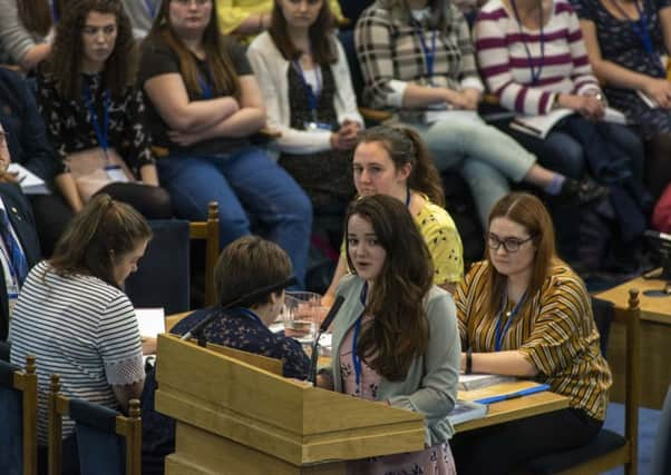 National Youth Assembly Moderator Tamsin Dingwall delivers the group's annual report