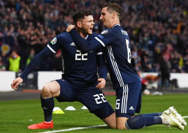 Kenny McLean hugs goal hero Oliver Burke in the win over Cyprus