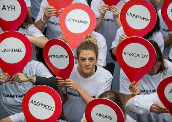 A protest on Glasgow's Buchanan Street steps against human trafficking.
 Picture: John Devlin