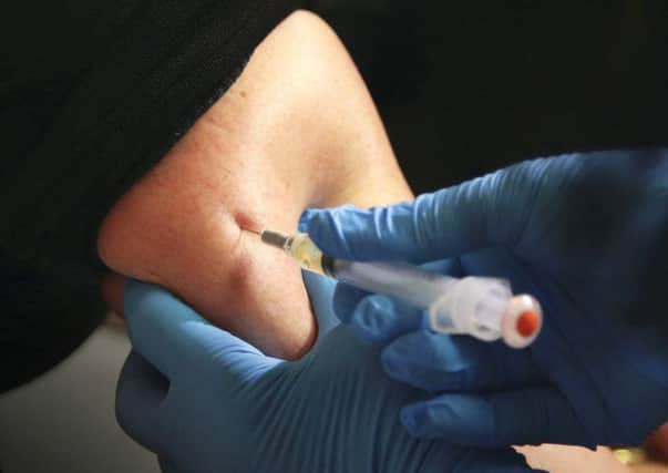 A girl receives a vaccination. Picture: AP Photo/Seth Wenig