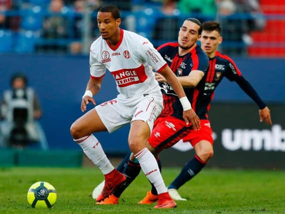 Christopher Jullien, left, has become Celtic's first signing of the summer.