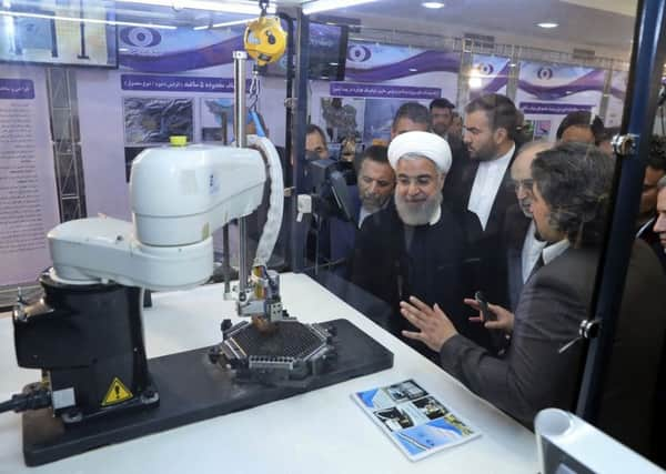 President Hassan Rouhani attends a ceremony to mark National Nuclear Day in Tehran (Picture: Iranian Presidency Office via AP)