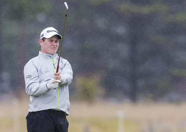 Robert MacIntyre practises in the rain. Picture: Bruce White/SNS