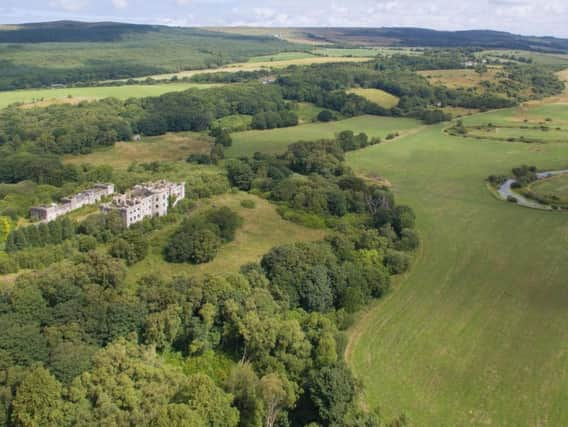 Dalquharran Castle and the original ruined medieval tower house have come on the market for offers over 800.000. PIC: Rettie & Co.