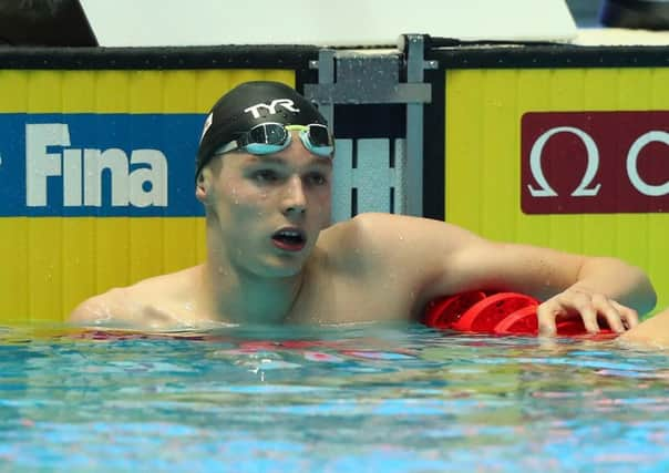 Duncan Scott checks his time on the results board. Picture: Catherine Ivill/Getty