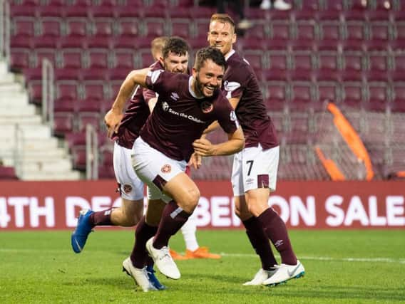 Craig Halkett wheels away after scoring for Hearts