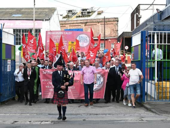 Workers leave the plant for the last time. Picture: John Devlin