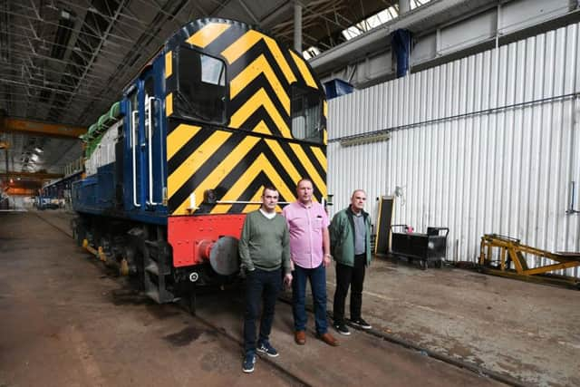 Unite convener Les Ashton, centre, with fellow workers at the plant. Picture: John Devlin