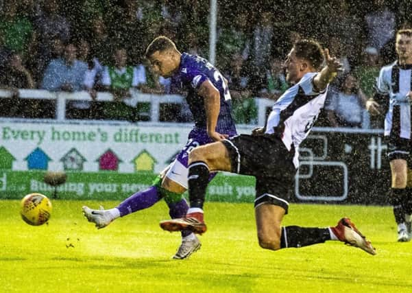 Florian Kamberi scores Hibs second goal to seal their victory over Elgin City at Borough Briggs. Picture: SNS.