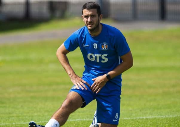 Kilmarnock's Gary Dicker limbers up for the start of the new Premiership season. Picture: Ross MacDonald