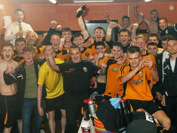 Fort William FC celebrate their tremendous victory.