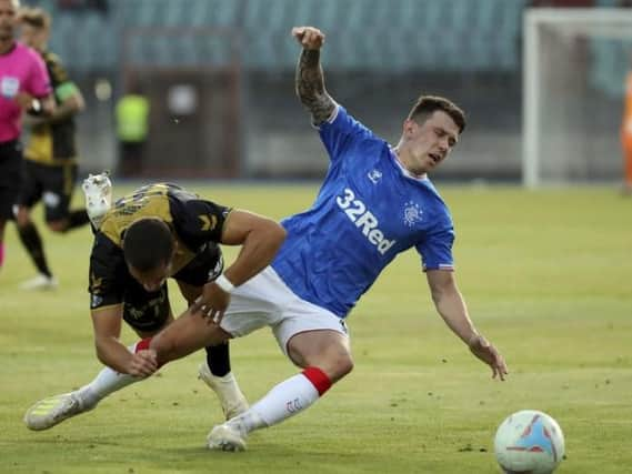 Ryan Jack battles for possession.