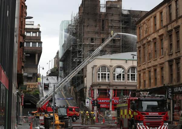 Tackling the devastating art school fire in 2018, just four years on from another blaze. Picture: Andrew Milligan/PA