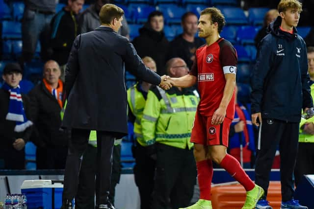 Steven Gerrard greets former Celtic defender Erik Sviatchenko after the game