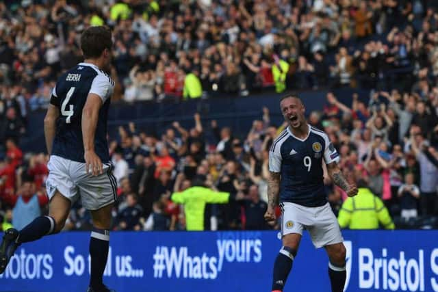 Leigh Griffiths celebrates after scoring against England.