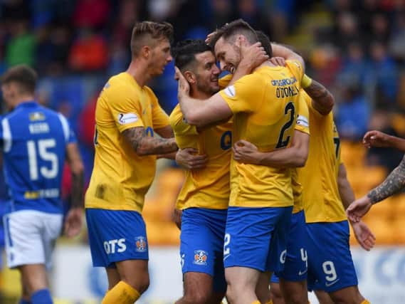 Stephen O'Donnell is congratulated by teammates.