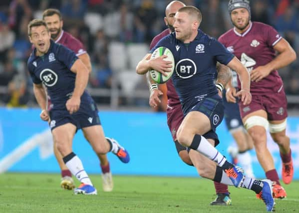 Finn Russell makes a break against Georgia. Picture: Levan Verdzeuli/Getty Images