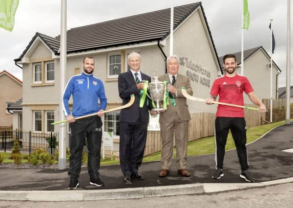 Newtonmores Evan Menzies, left, with George Fraser, of Tulloch Homes, Camanachd Association president Keith Loades and Obans Daniel Cameron.