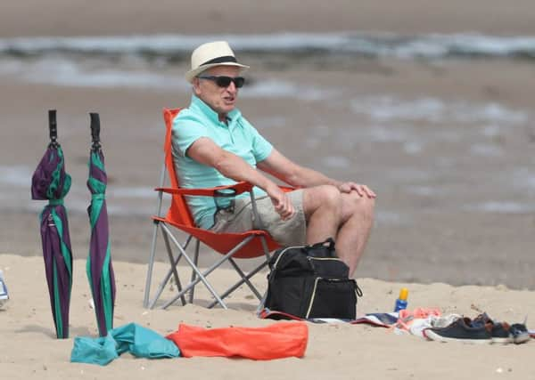 A sunny bank holiday means Portobello Beach is mobbed (Picture: Andrew Milligan/PA Wire)