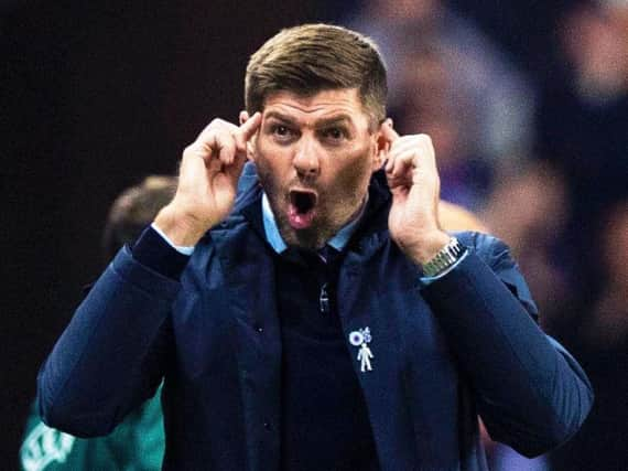 Steven Gerrard on the touchline.