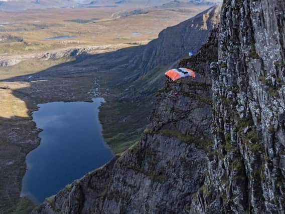 Sam Percival, 35, miraculously survived the horror fall after his parachute spun mid-jump, slamming him into the sheer cliff face at speeds of at least 30mph.