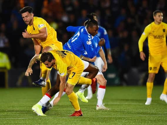 Rickie Lamie clashes with Joe Aribo. Picture: SNS