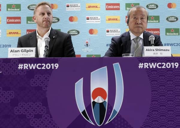 Alan Gilpin, left, tournament director for the 2019 Rugby World Cup and Japan Rugby 2019 CEO Akira Shimazu, right, give an update on Typhoon Hagibis. Picture: Eugene Hoshiko/AP