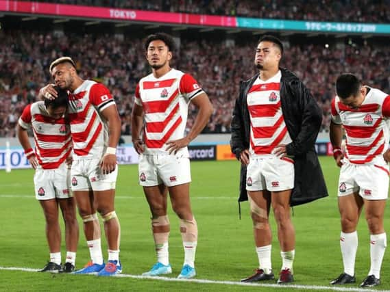 Yutaka Nagare, Lomano Lemeki, Ryohei Yamanaka, Yu Tamura and Fumiaki Tanaka of Japan are dejected at the final whistle