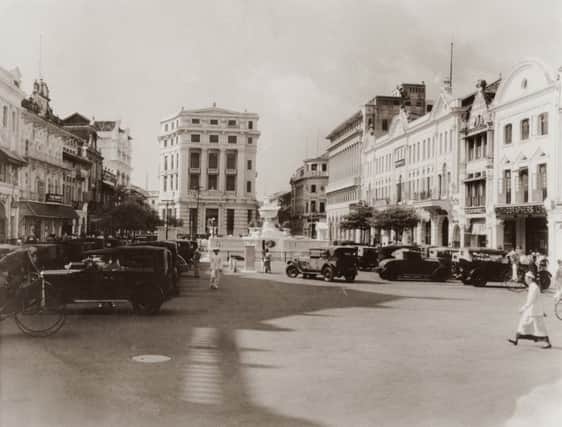 A view across Raffles Place towards the Mercantile Bank of India (centre, left), Singapore, circa 1925. (Photo by Hulton Archive/Getty Images)