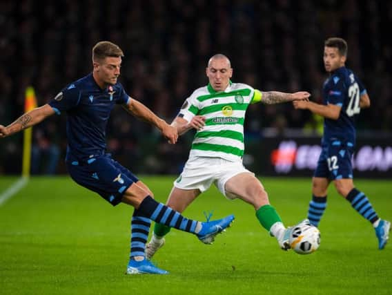 Celtic's Scott Brown holds off Lazio's Sergej Milinkovic-Savic