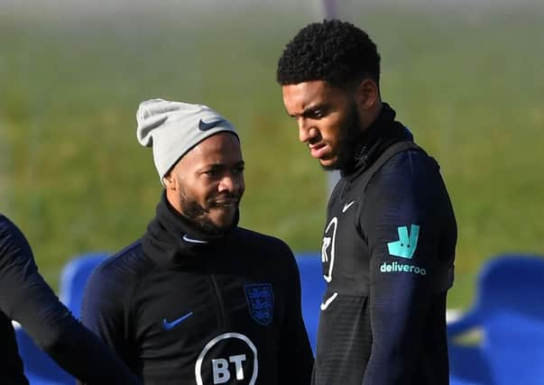 Raheem Sterling, left, and Joe Gomez at training ahead of the England v Montenegro match.  Photograph: Michael Regan/Getty.