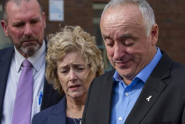 With Detective Inspector Scott Beard (L) the parents of Grace Millane, David and Gillian Millane speak to media outside Auckland High Court.