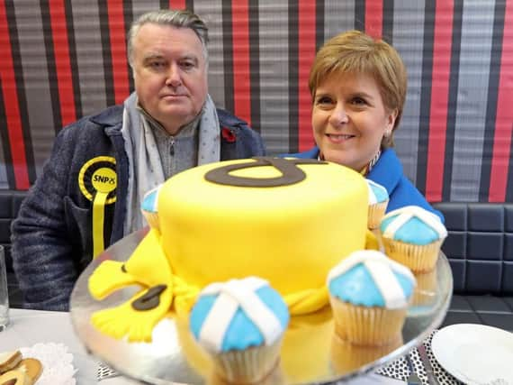 John Nicolson with Nicola Sturgeon on the campaign trail. Picture: PA