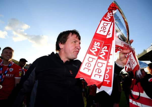 Daniel Stendel celebrates winning promotion to the Championship with Barnsley last season.