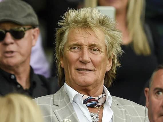 Sir Rod Stewart is fighting it out to have this year's Christmas No.1 album
