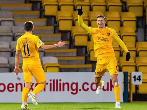 Lyndon Dykes celebrates scoring for Livingston.