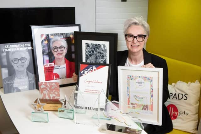 Celia Hodson of Hey Girls with her awards. Picture: Scottish Enterprise.