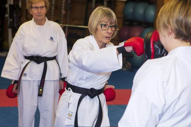 The fighting fit duo- both from Dalgety Bay, Fife - went through twelve grades from white belt, before being awarded their coveted black belts.