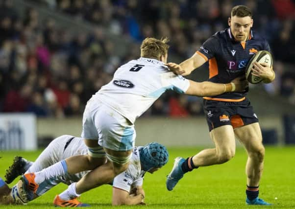 George Taylor is tackled by Glasgows Jonny Gray during the second leg of the 1872 Cup tie on Saturday. Picture: SNS/SRU