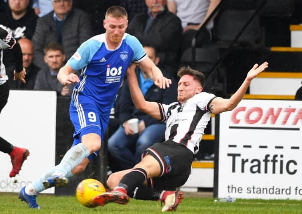 Rory McAllister, left, in action for Peterhead. Picture: SNS