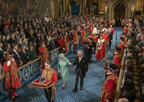 Queen Elizabeth passes through the Royal Gallery on her way to the Lords for the state opening of Parliament (Picture: Jack Hill/WPA Pool/Getty Images)