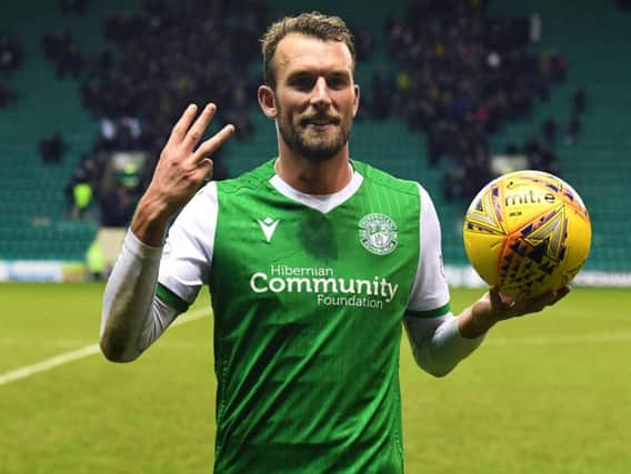 Christian Doidge celebrates with the match ball after his hat-trick. Picture: SNS