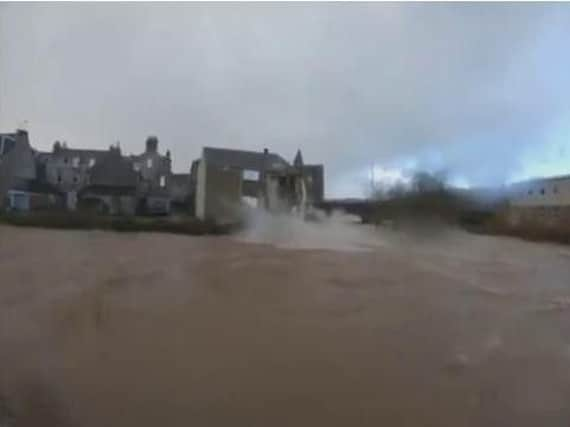 The front of the guest house can be seen collapsing.